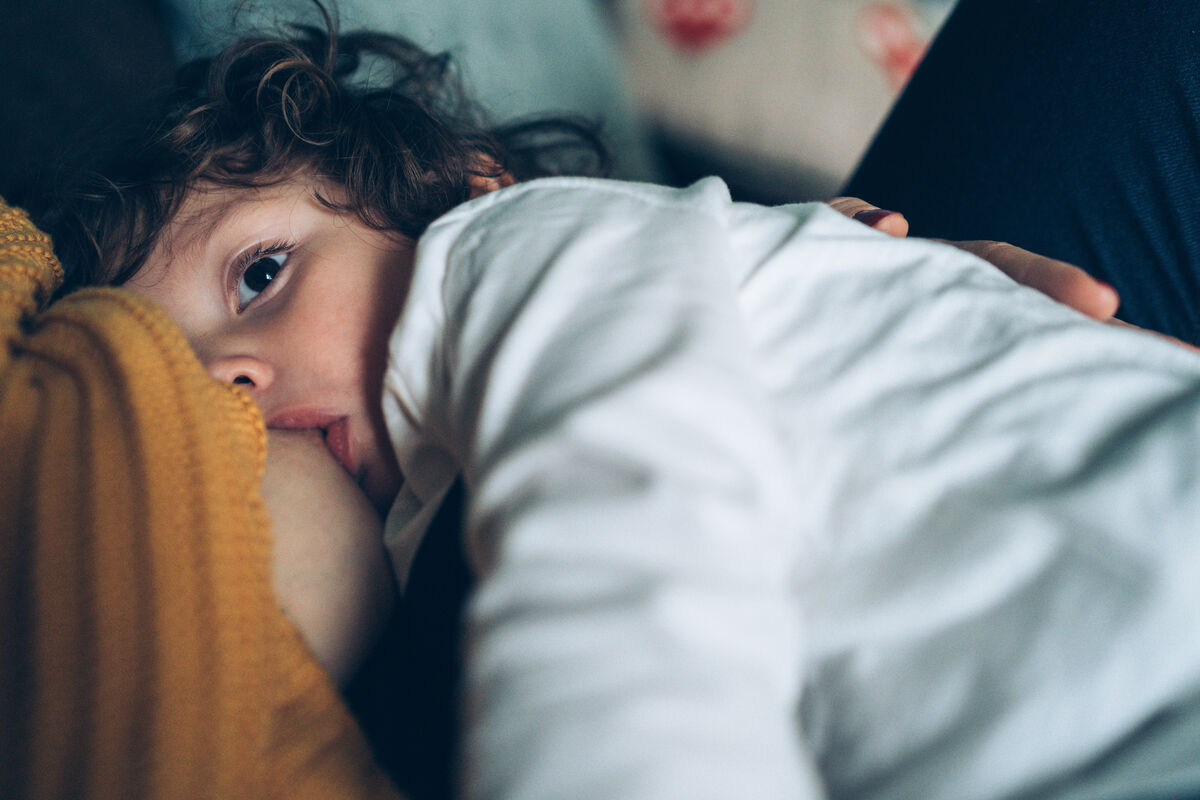 son breastfeeding close up