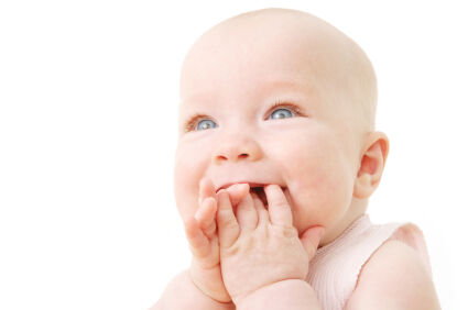 baby smiling and looking up