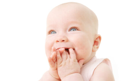 baby smiling and looking up