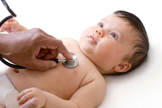 Doctor examining baby