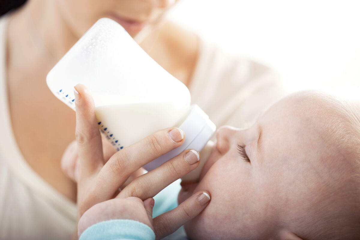 Baby drinking milk from bottle