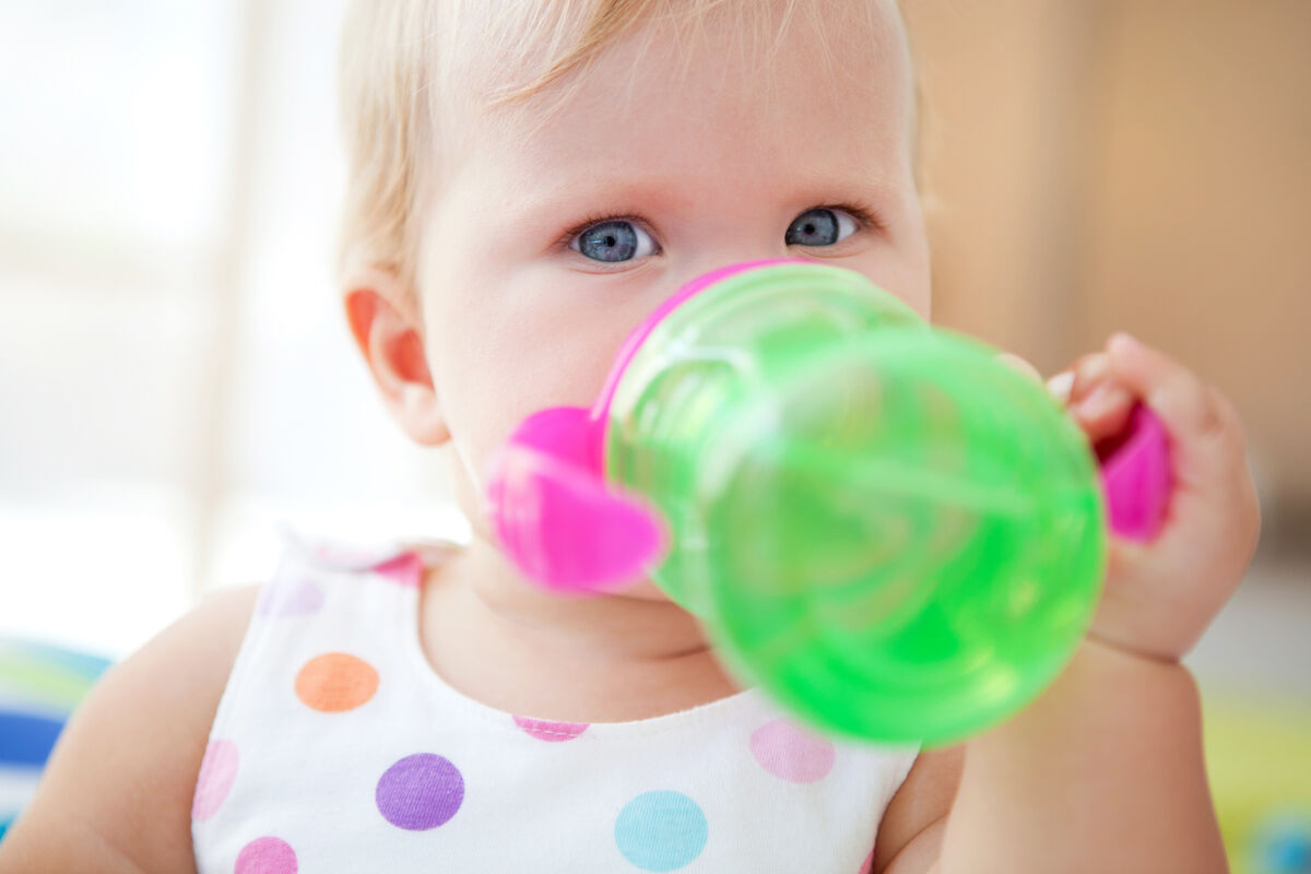 Cute baby drinking water