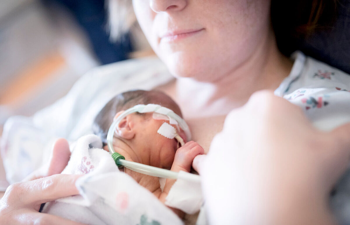 Mom holding preemie