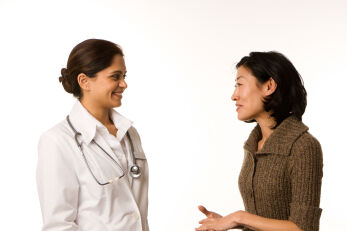 Young woman talking with her doctor