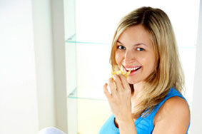 Pregnant woman eats chips