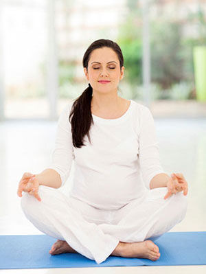 Pregnant woman meditating