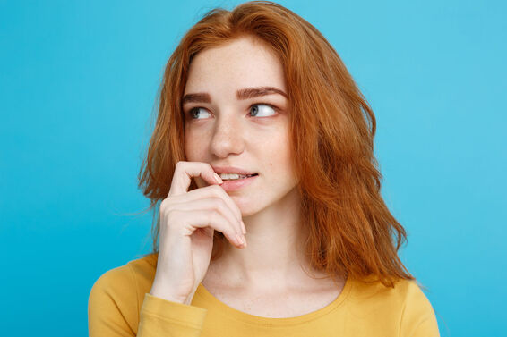 Woman pondering ovulation and menstruation