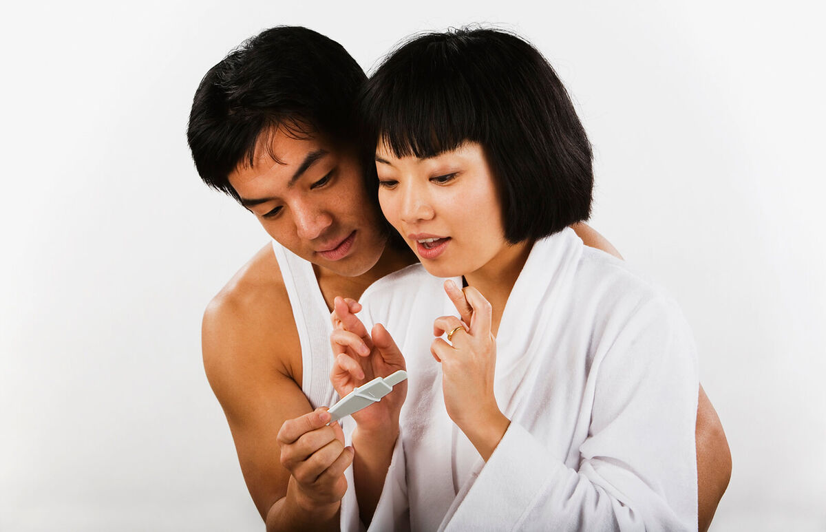 couple looking at pregnancy test