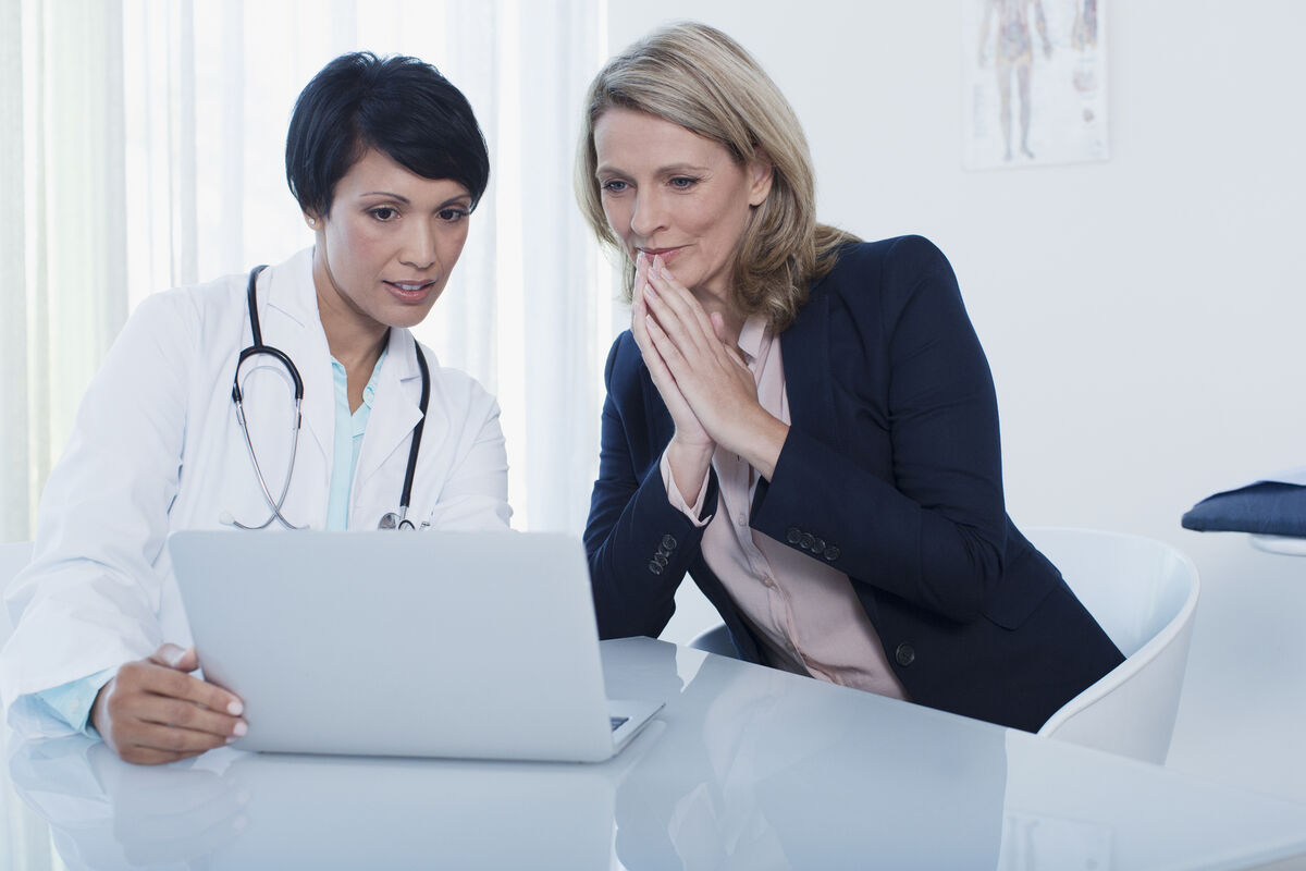 woman with her doctor in office