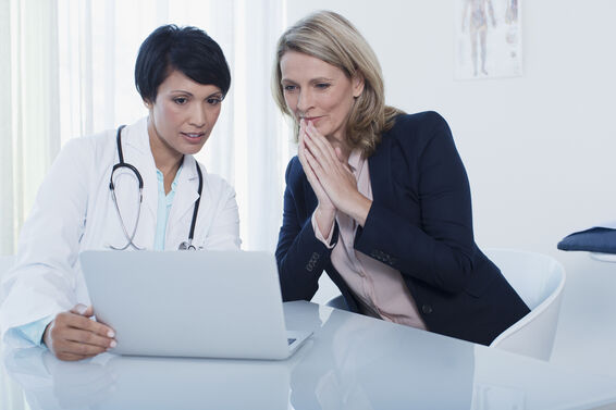 woman with her doctor in office