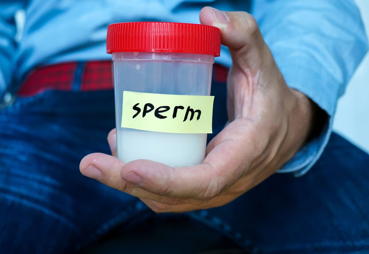 Man hands holding sterile sample container bottle