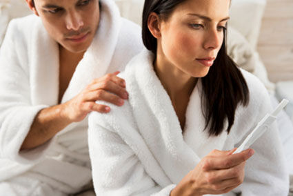 Woman reading pregnancy test