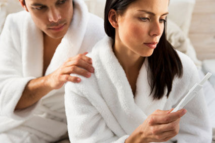 Woman reading pregnancy test