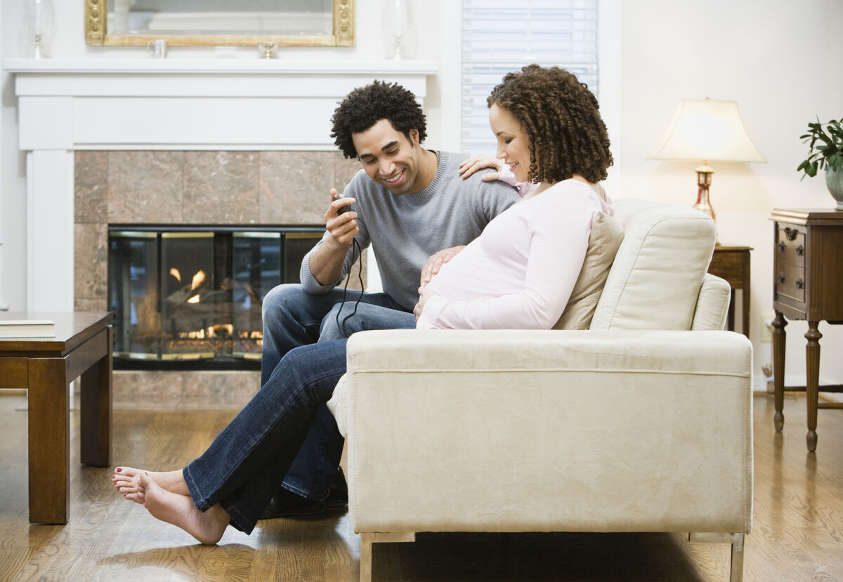 Man timing his partner's contractions