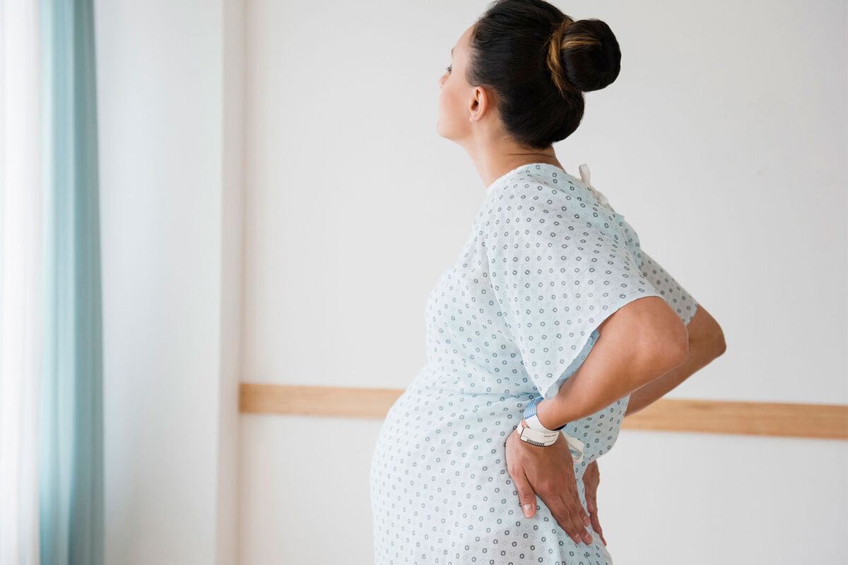 pregnant woman in early labor standing up