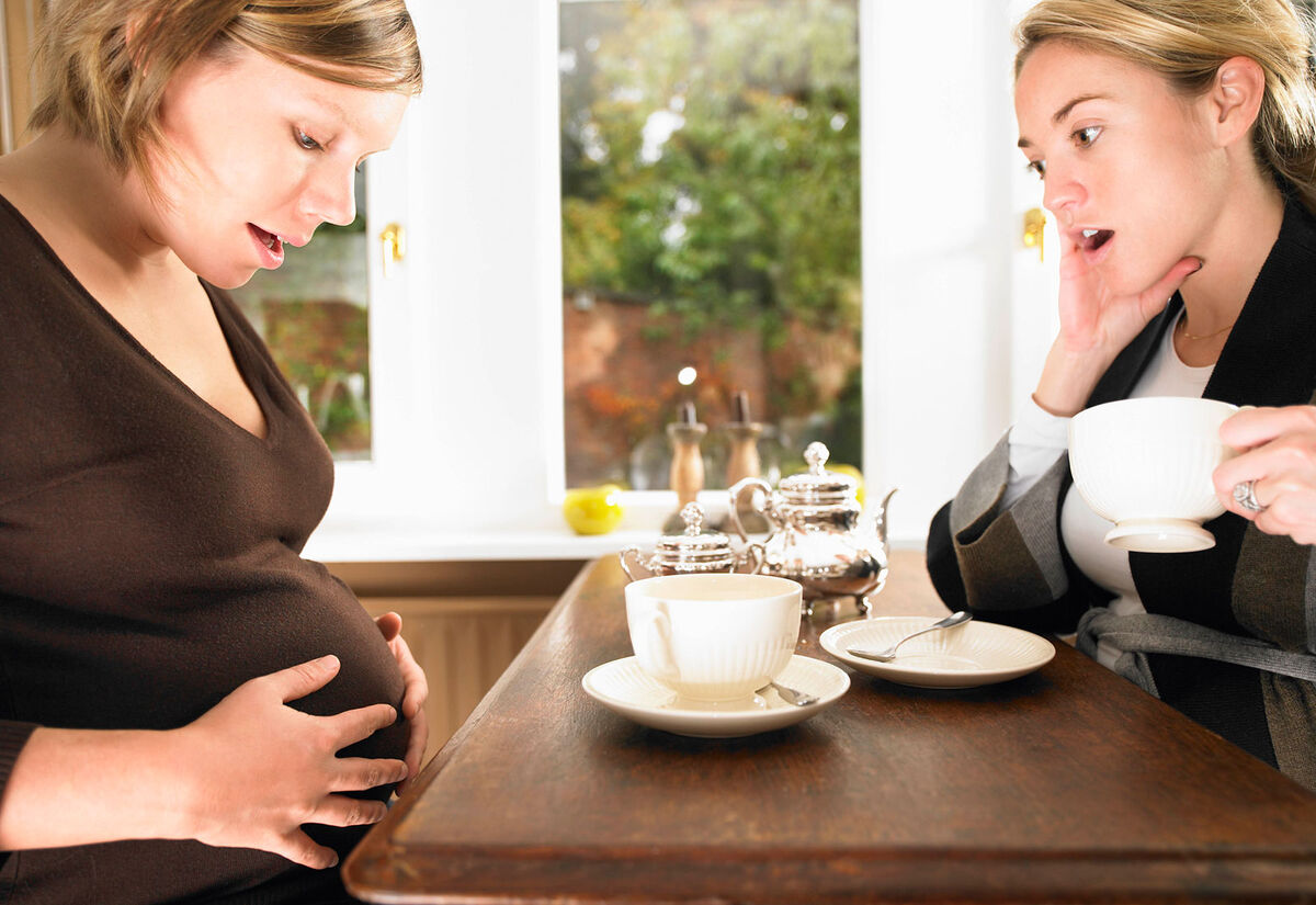Surprised pregnant woman's water breaks
