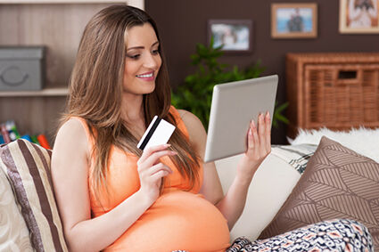 Pregnant woman buying discount maternity clothing online