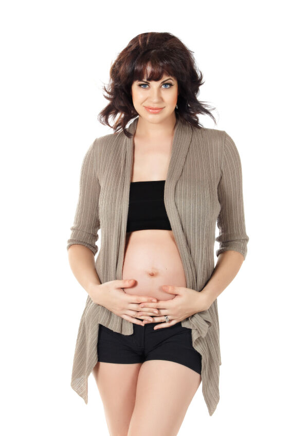 Pregnant woman wearing a cardigan