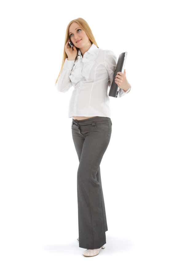 Pregnant woman wearing maternity dress pants