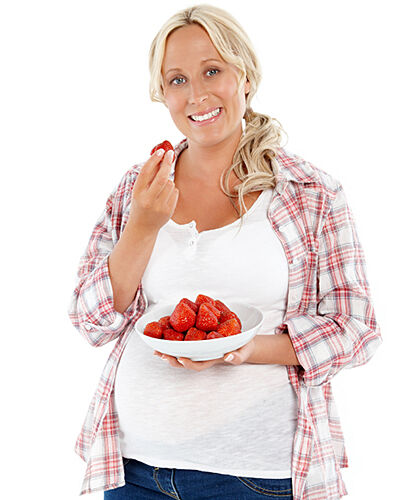 Pregnant woman in a button down shirt