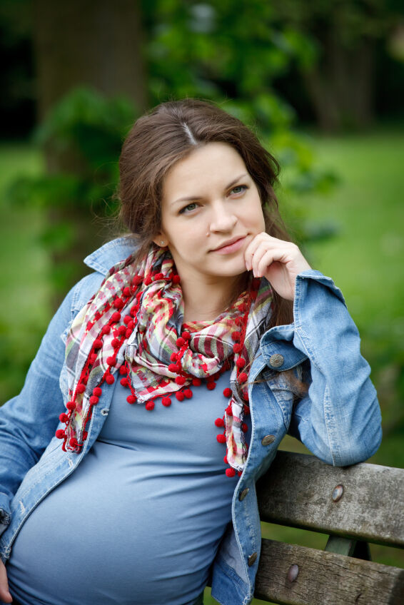 Pregnant woman wearing a fashion scarf
