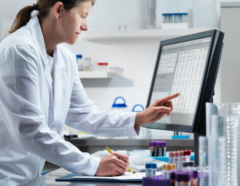 Scientist using computer in lab