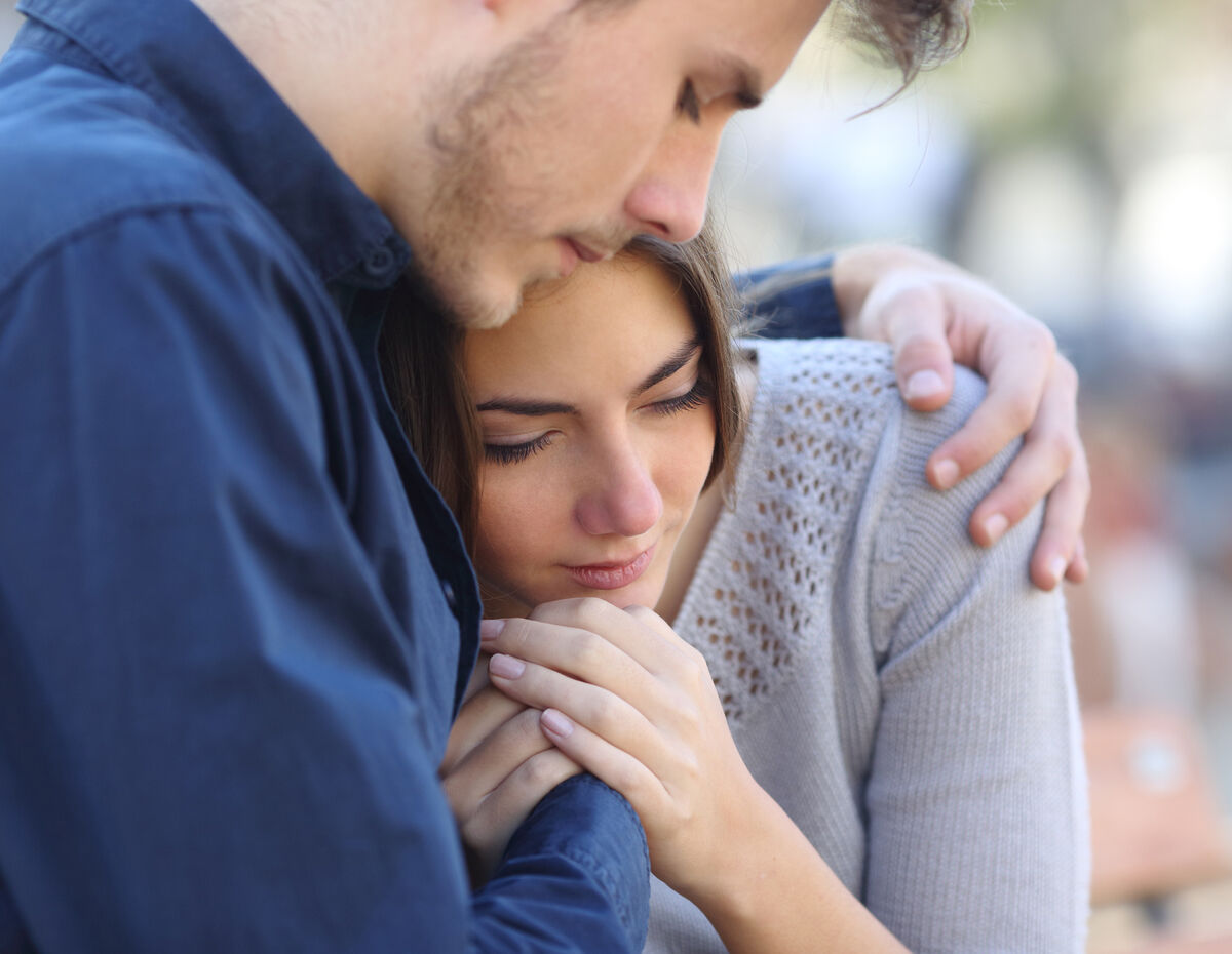 grieving woman and man