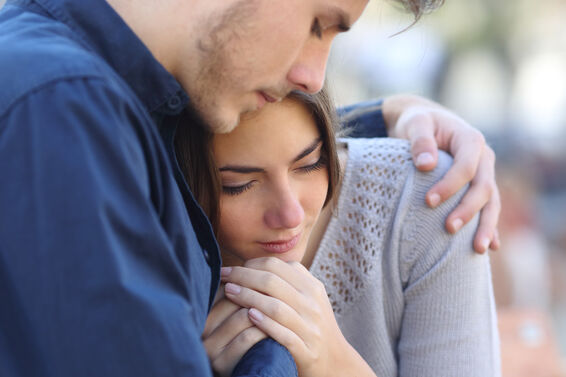 grieving woman and man
