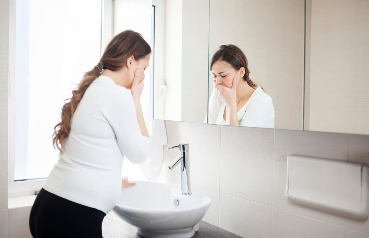 Pregnant woman in the bathroom
