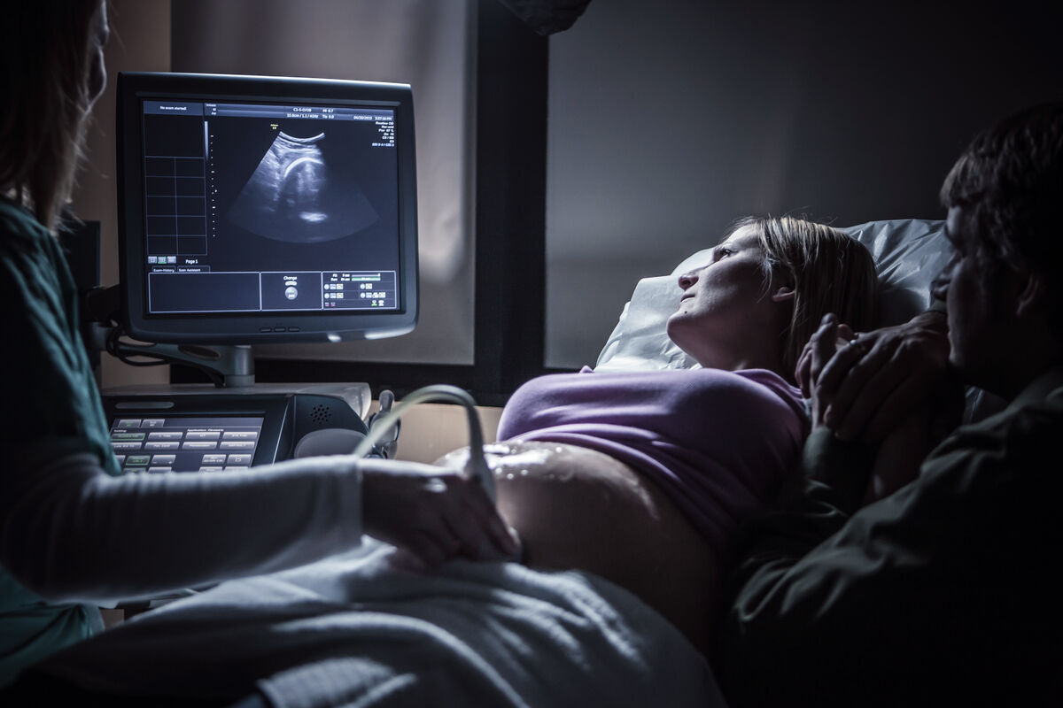 Pregnant couple having sonogram