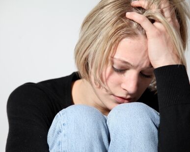 Young woman upset over a miscarriage