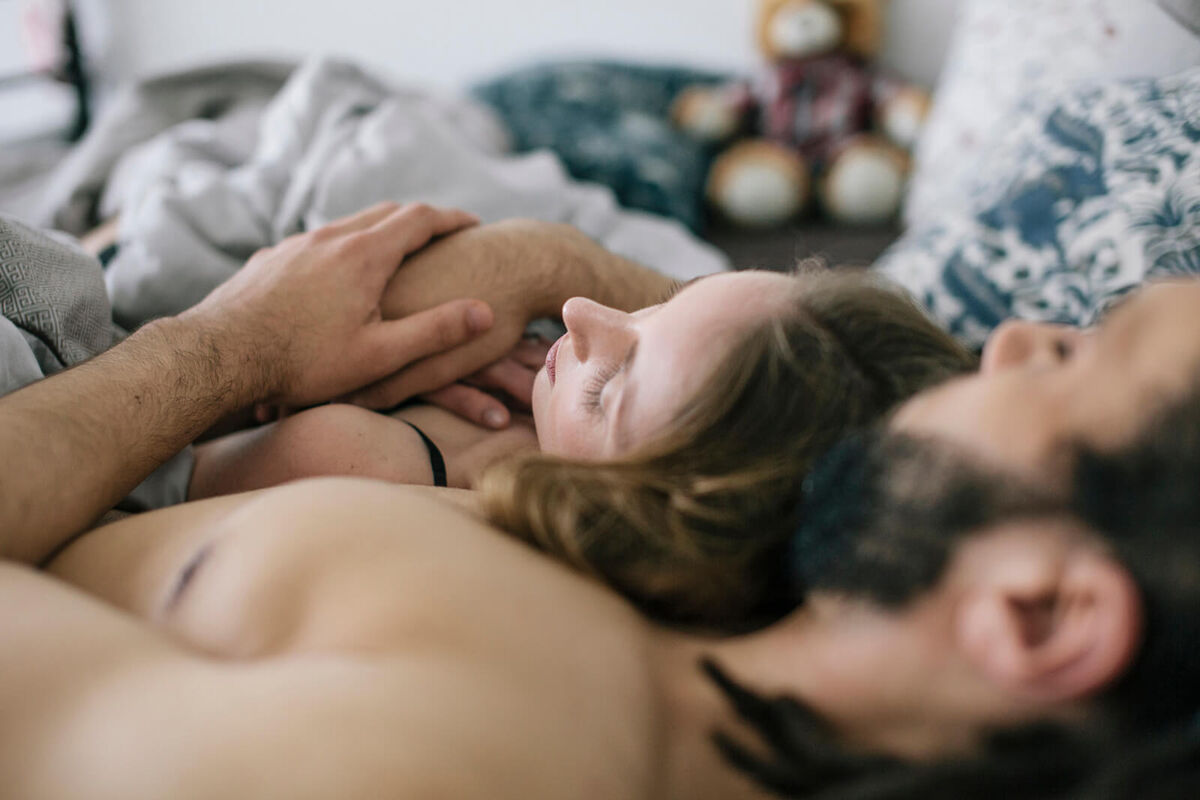 Couple sleeping together in bed