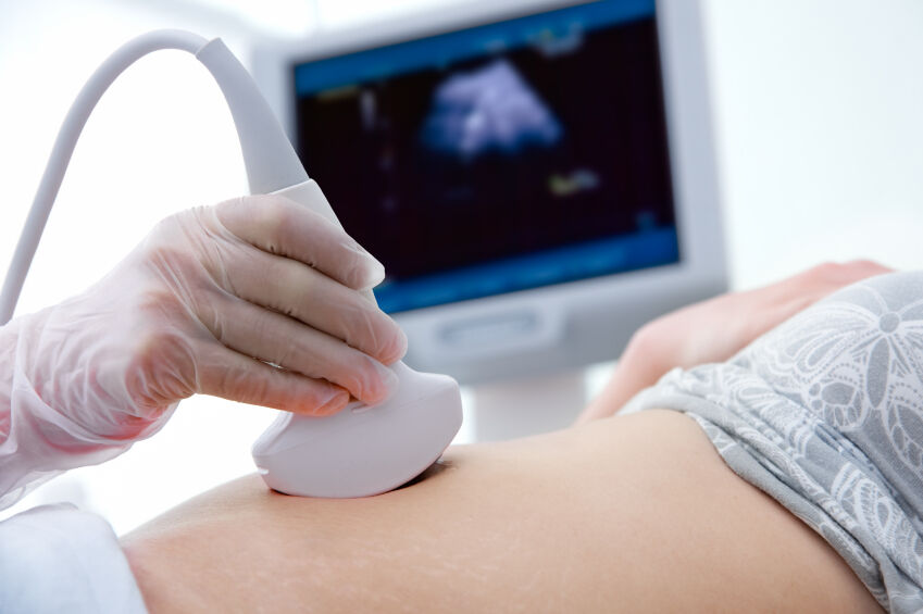 Pregnant woman having an ultrasound at 12 weeks