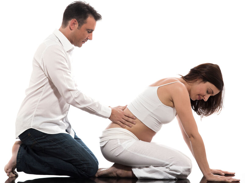 Husband coaching his wife at a prenatal class