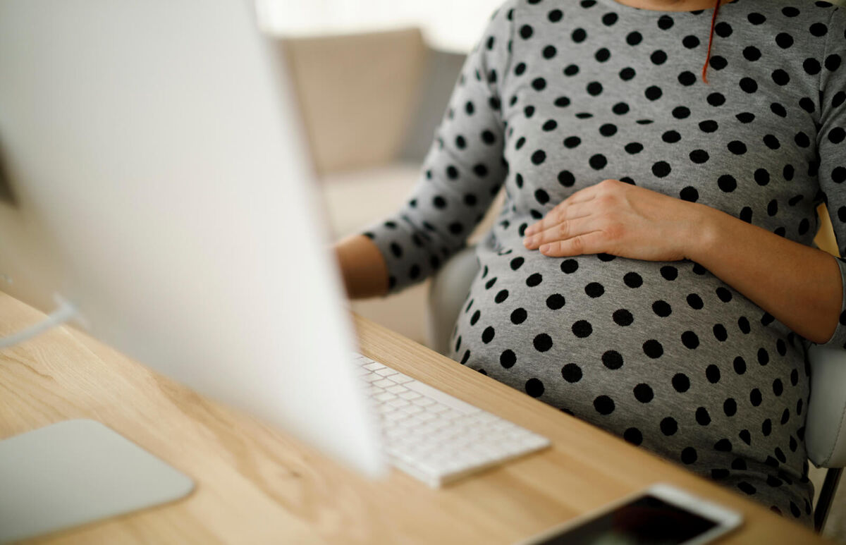 Pregnant woman working from office
