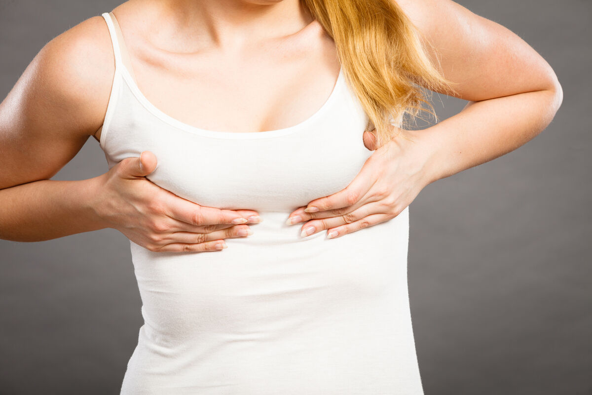 Woman suffering from breast pain