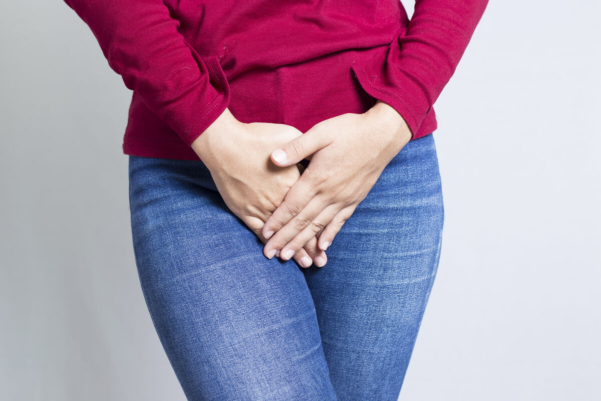 Woman with Hands Over Crotch