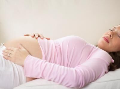 Pregnant woman on her back