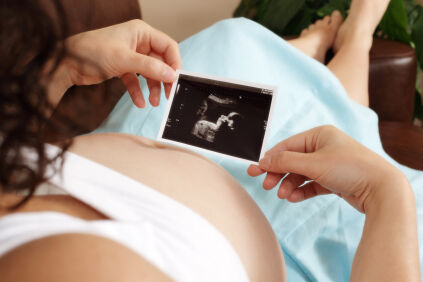 Woman looking at sonogram