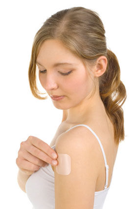 woman applying birth control patch