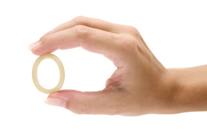 Woman's hand holding a birth control ring
