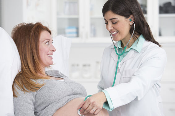Doctor checking pregnant woman