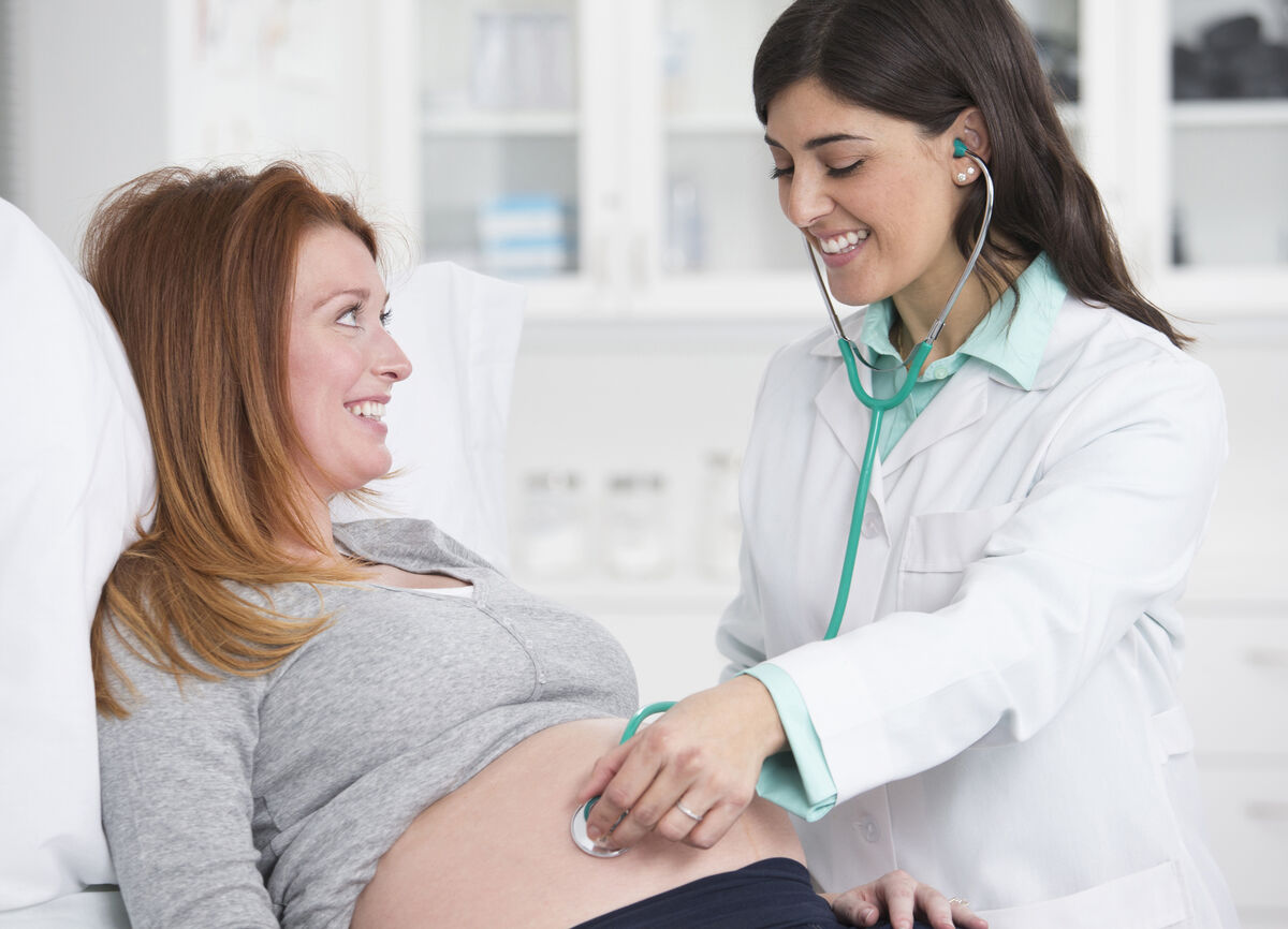 Doctor checking pregnant woman