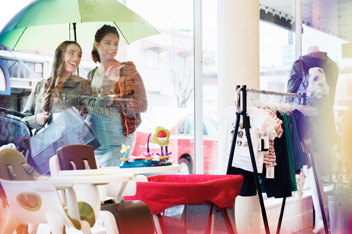 Two woman shopping for maternity gifts