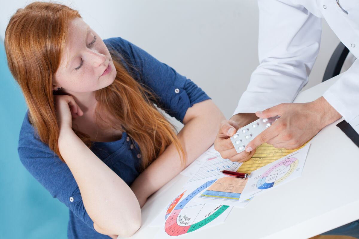 Woman talking about contraception with a gynecologist