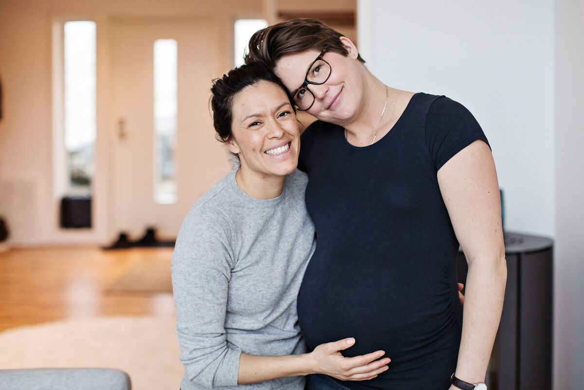 Happy pregnant woman with partner