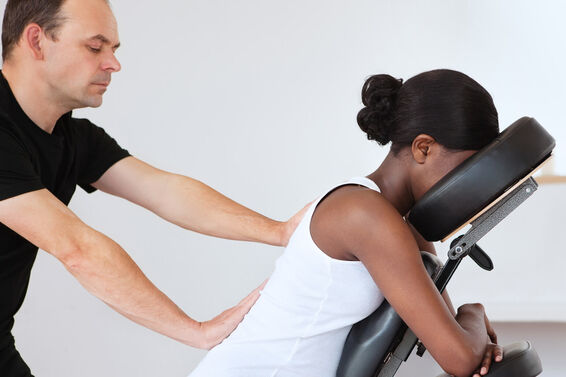 Pregnant woman getting a chair massage