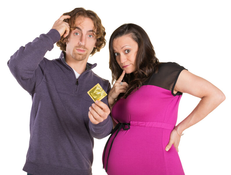 pregnant couple with condom