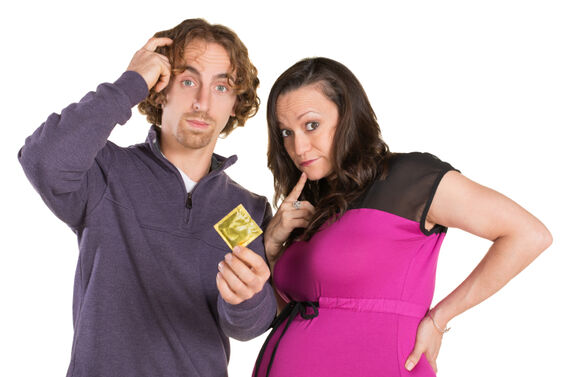 pregnant couple with condom