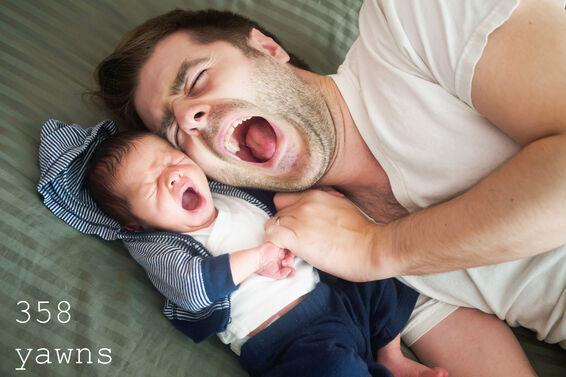 Father and son yawning